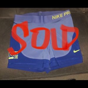 Nike Pro Shorts. Blue, light blue and neon yellow lettering. Gently used.
